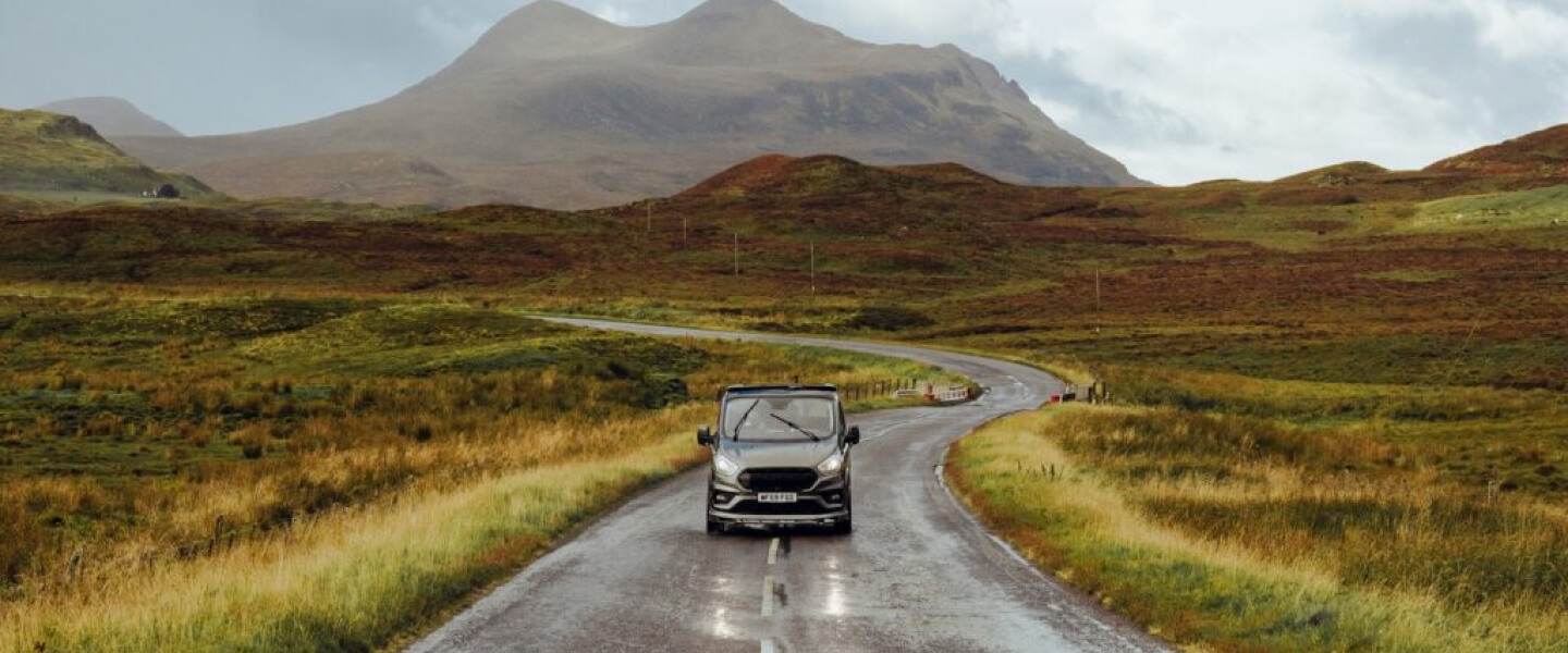Van driving on a road